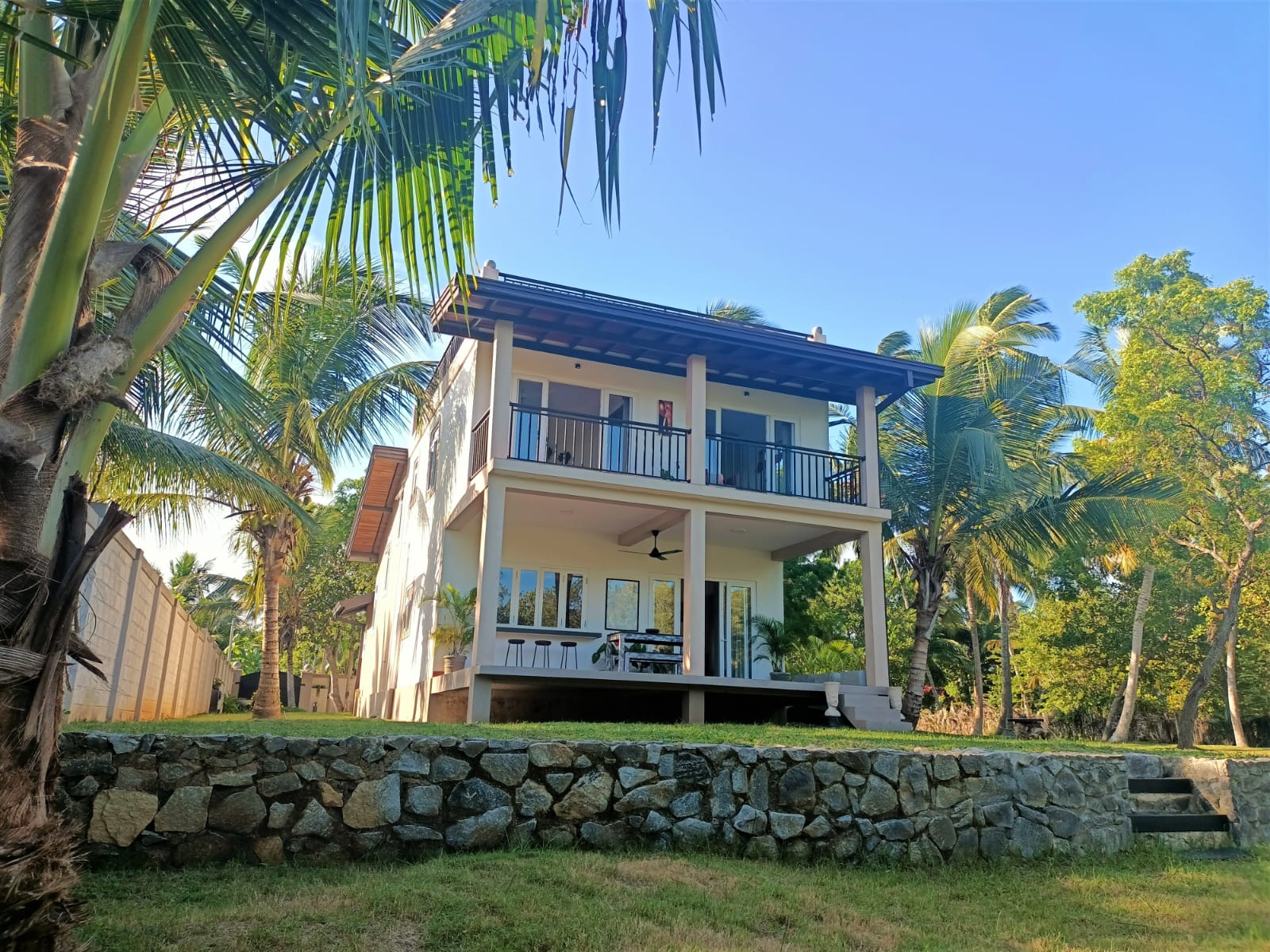 THE LAGOON HOUSE (VILLA) AND LAND  Lands sizes – LAND 1- 30 perches, LAND 2 – 112 perches, LAND 3 – 43.5 perches (all together 185.5 perches). House size 345.29 square metres.

 3 double bedrooms with ensuite bathroom that are provided with high quality fittings, and hot and cold water installation. 
There is also a one washroom/family bathroom. The main bedroom has a walk – in – wardrobe.
 The living room is equipped with landline broadband SLT cable to access PEO TV Channels.
 The kitchen is equipped with a washing machine, dishwasher, fridge freezer and cooker with oven (European Brands).
 Air-conditioning and ceiling fans are installed in all the bedrooms and living room.
 There are 2 rooftop terraces (with spectacular views of the 3 km long Rekawa lagoon).Also a balcony in the second floor and a veranda in the ground floor with a ceiling fan. 
The house is fully furnished with fixed and fittings. The lands are divided as per the Plan number 0288 by surveyor Mr Kumarasiri(Registered Licensed Surveyor). Approved building plans stamped by Local Authorities and Deeds available. 
Land 1 has municipal water. Land 1 has municipal electricity 3 phase and Land 2 has also municipal electricity 3 phase.
 All the lands are covered by palm trees. There aren’t any temples or schools in the immediate vicinity to the property. Termites Treatment Certificate on the villa is for 10 years. The nearest swimmable beach is 3.7 km distance and it takes 9 minutes by road and less than 0.8 km crossing the Rekawa Lagoon. 
Rekawa Turtle watch is 3.7 km distance and it takes 9 minutes by road and you can observe species of sea turtles like loggerhead, hawksbill, olive ridley and leatherback turtles coming to lay their eggs. Agro – Technology Park is 8 Km Kalametiya Kalapuwa is 10 Km Akkarapaha Playground is 12 Km Mulkirigala Rock Monastery is 8.3 Km The Rekawa Lagoon area is a conservation area located next or very near the beach. It is surrounded by huge mangrove trees and enjoys peacocks, lizards (land and water monitors), mongooses, monkeys, squirrels, rabbits and a large variety of birds (herons,pelicans, Kingfishers, common cormorants, sea eagles, backyard hawks, seagulls, falcons, etc). A few locals can be seen fishing mainly prawns and korali fish. Tours and water sports like Kayaking, Surfing paddle, fishing trips, etc, can be experienced at the lagoon.  The land and property is facing directly to the lagoon. Good Internet connection.
 The nearest town for grocery shopping, pharmacy, banks, hospital, petrol station, etcare,- Netolpitiya - Grocery shops, Santhula Restaurant, juice bar and coffee shop, pharmacy, bank cash point, communication and hardware shops are at 2.2 km distance from property. 
There is a bus stop with several buses travelling to various destinations including a Highway Bus going to Colombo.- Ranna – Petrol station is at 6.4 km distance from property.- Tangalle – Banks, Hospitals, petrol stations and other stores and outlets like Keels and Food City are at 8.7 km distance from the property. 
Pizza Hut and KFC are based in Tangalle and offer food delivery. Many other restaurants are locatedalong the beach offering foreign and Sri Lankan cuisine and fresh seafood.
 The nearest International Airport is Mattala airport at 51 km distance. Yala National Park is at 84 km distance.
The property is in very quiet vicinity. With 3 entrance gates, the whole land is ideal for the construction of a hotel with a restaurant and swimming pool and adding the water sports due to the land beingbound to the Rekawa Lagoon. Other facilities like Ayurveda, yoga and meditation are perfect for this conservation area.